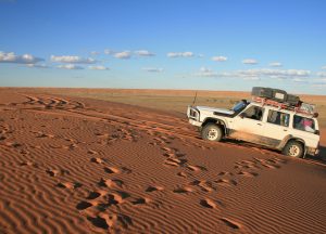 4wd climbing a hill in outback